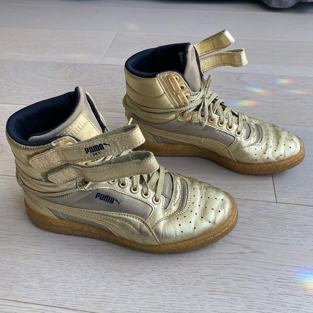 Puma gold high tops with Velcro straps. Gently worn. Size W6.5
